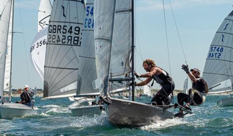 mid shot of sailors during a multiclass dinghy racing